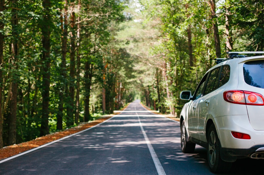 car driving down road