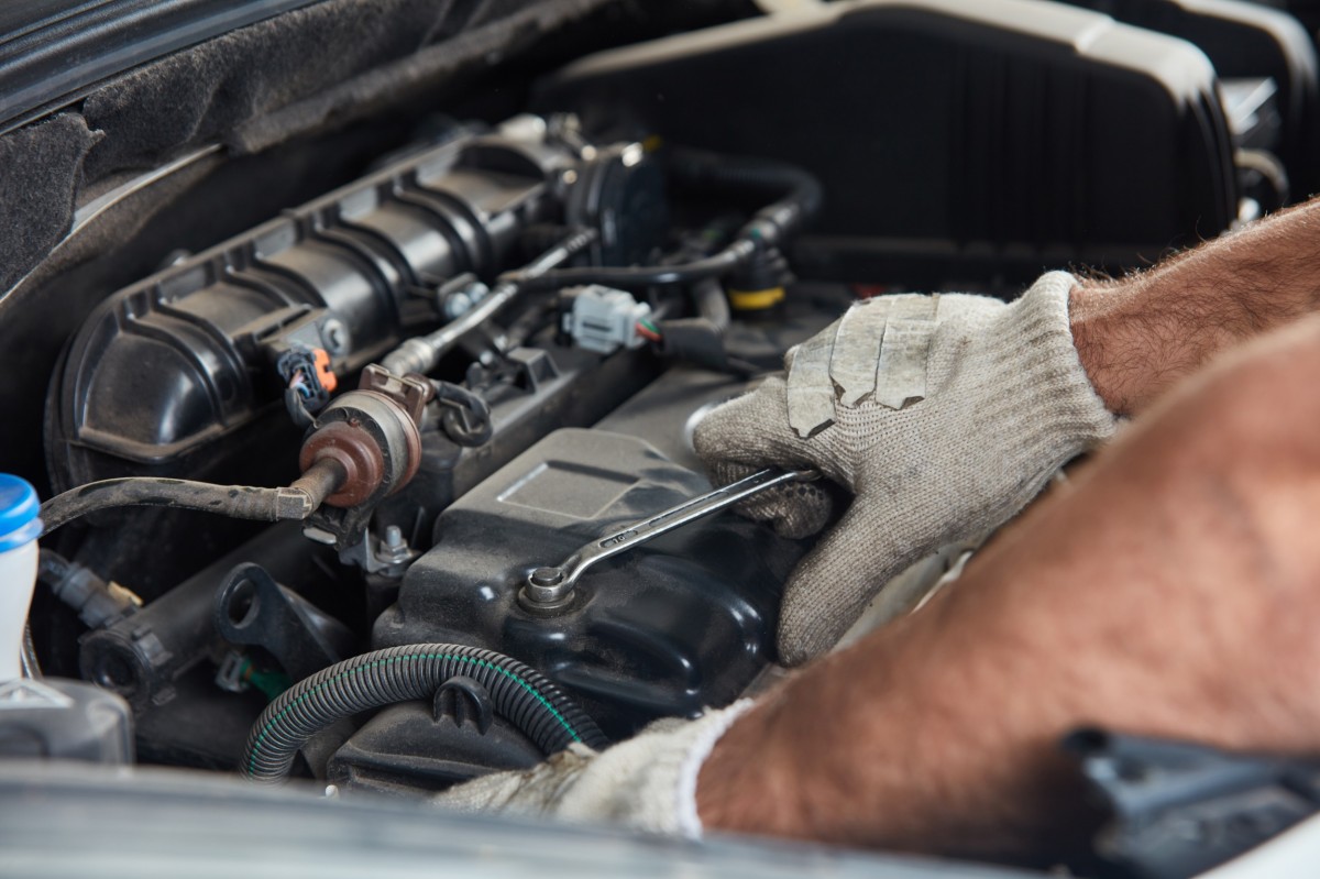 mechanic working on an engine