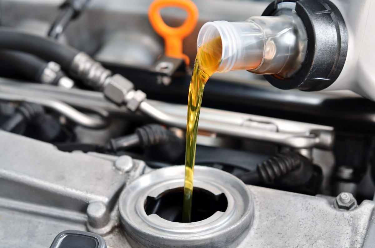 oil being poured into an  engine